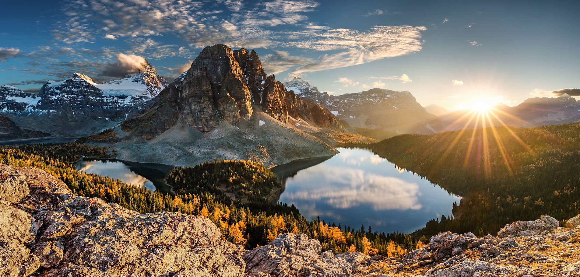 Sunlit mountain ridge above the clouds